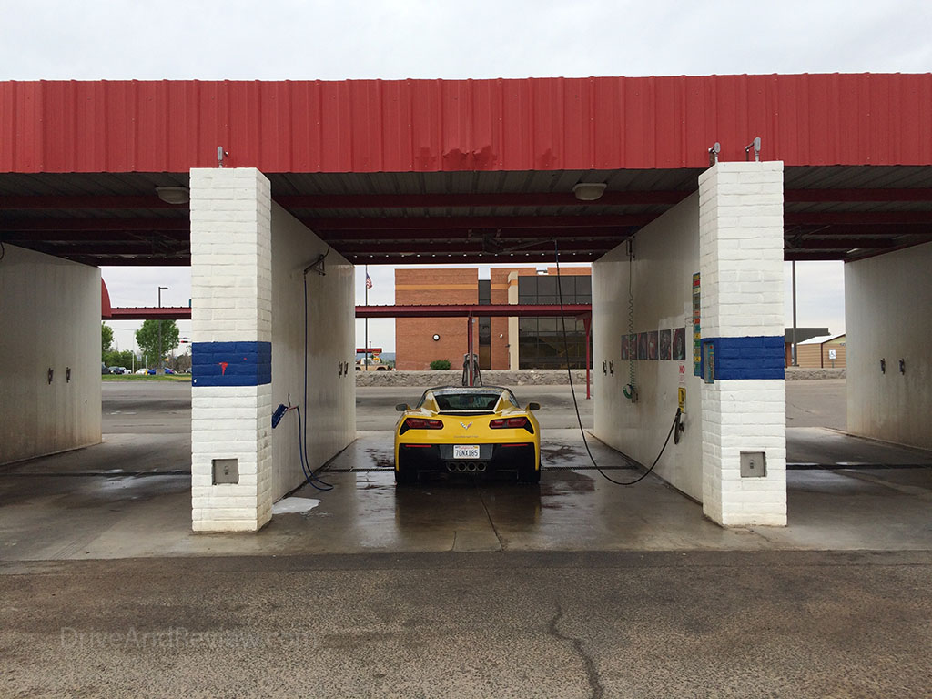 corvette c7 in a coin operated car wash