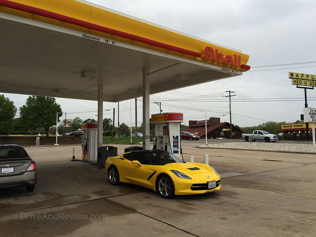 yellow c7 corvette at shell gas station