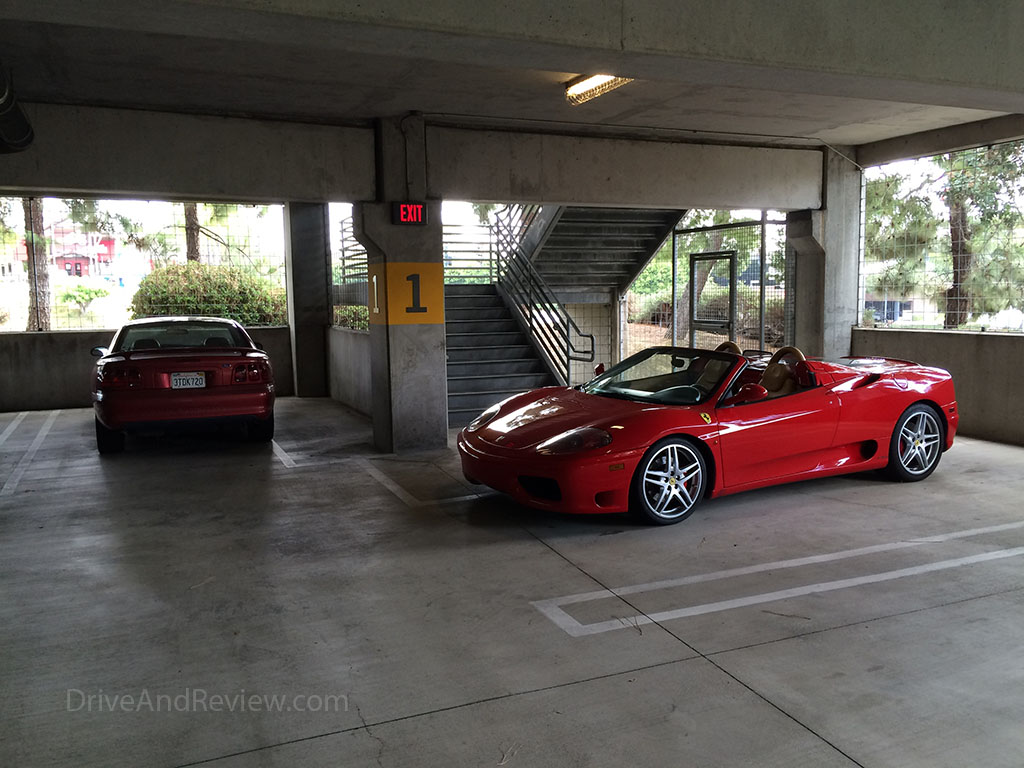 ferrari parked next to my mustang gt