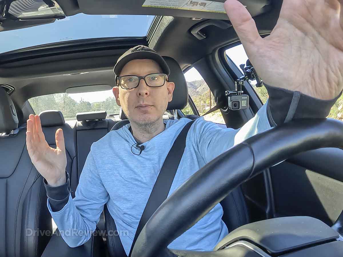 Scott from DriveAndReview in a BMW 330i