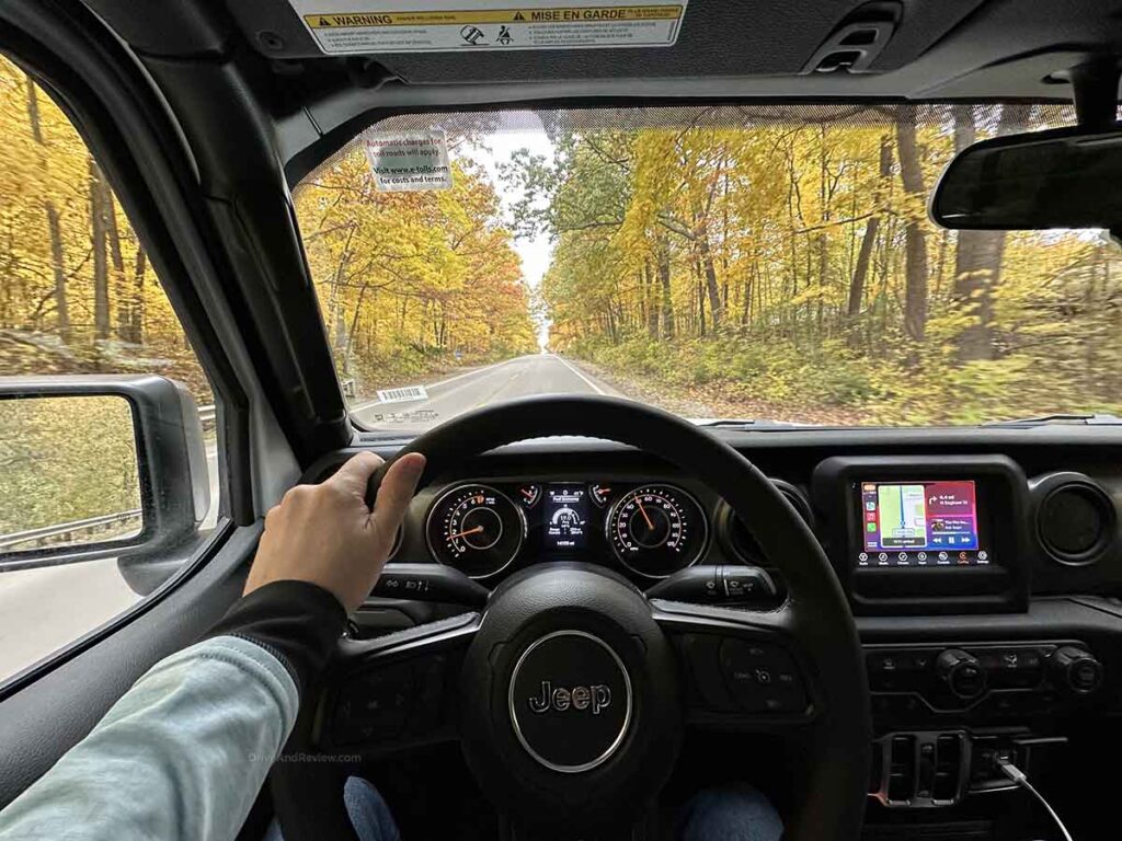 Driving a jeep gladiator down a two lane road