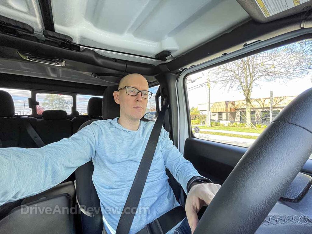 Scott sitting in the driver's seat of a 2023 jeep gladiator