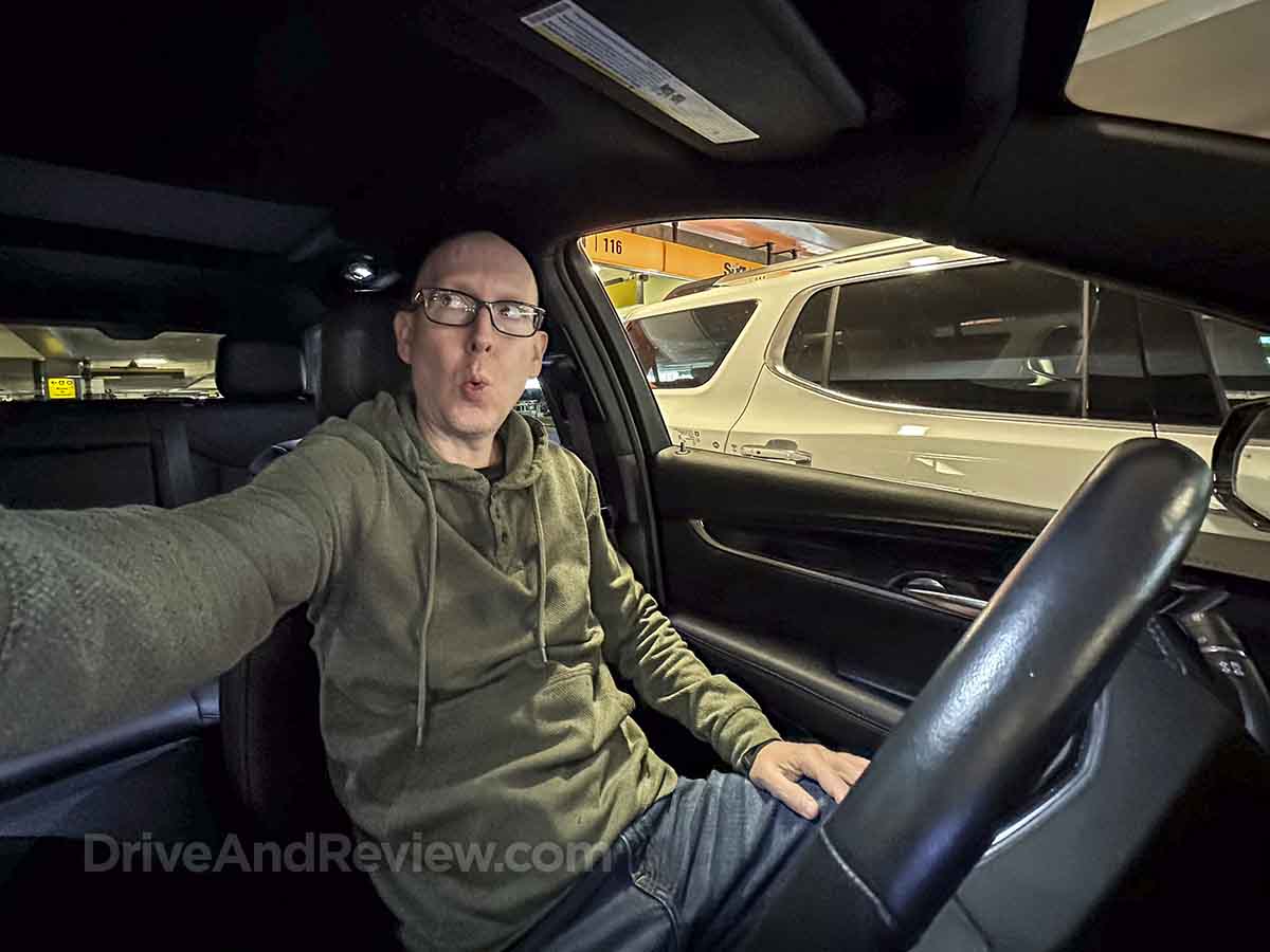 Scott looking impressed in a 2023 cadillac xt5