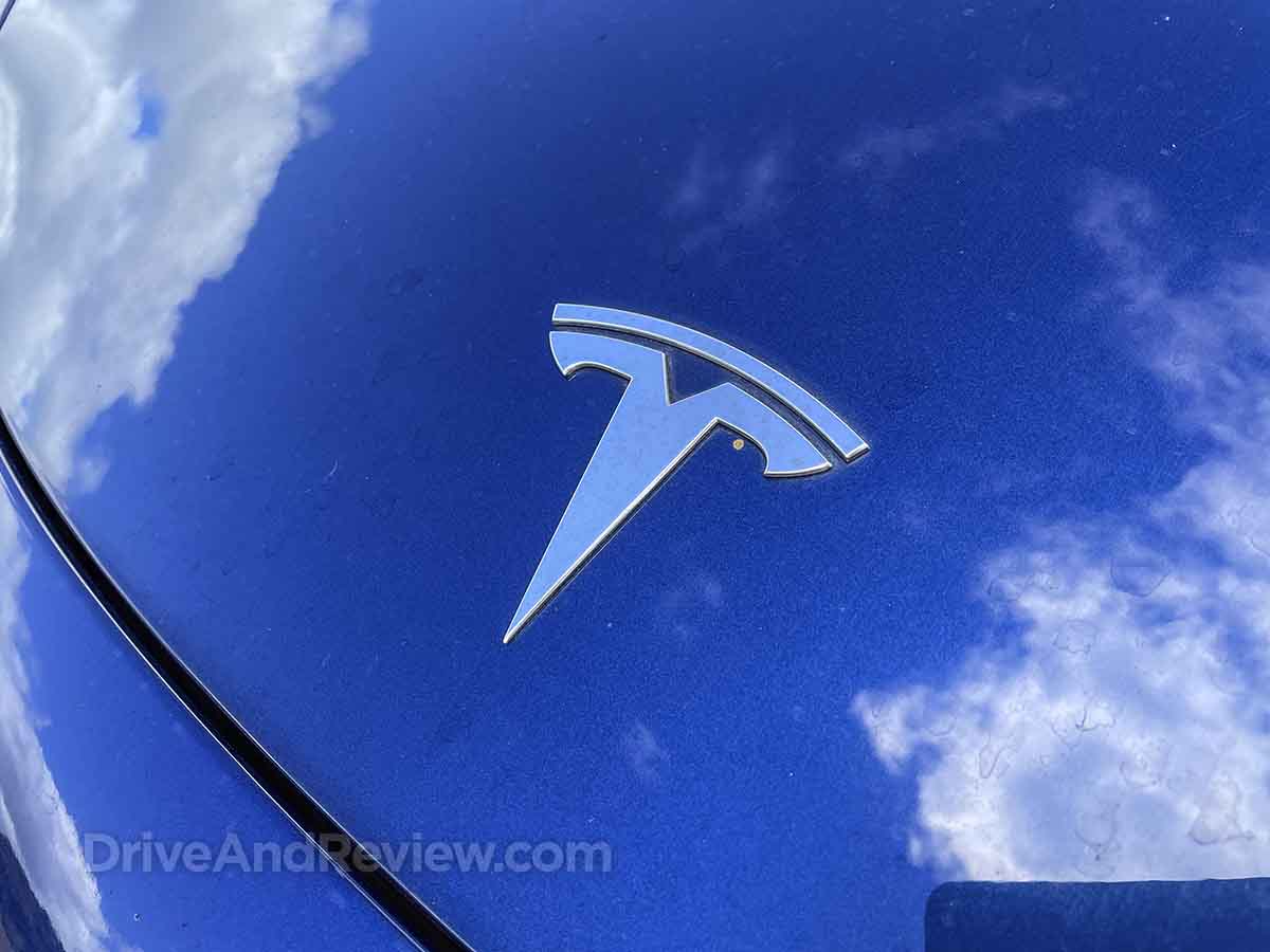 2023 Tesla Model 3 logo on the hood