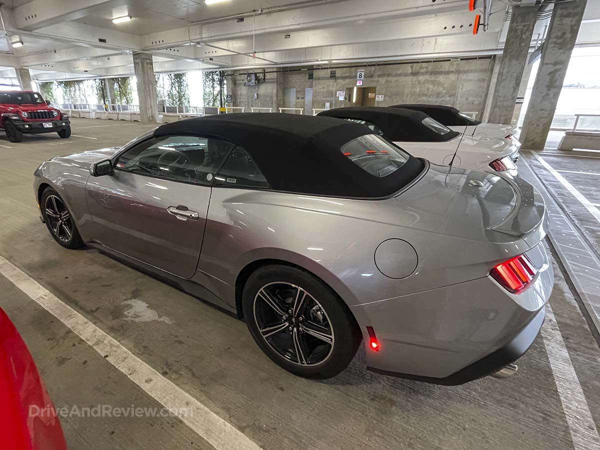 Silver 2025 Ford Mustang Convertible rear three-quarter view