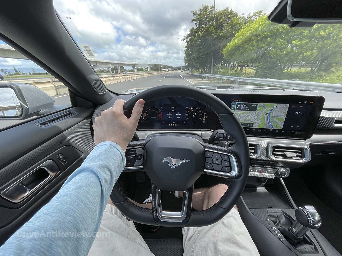 POV driving a 2025 Ford Mustang convertible