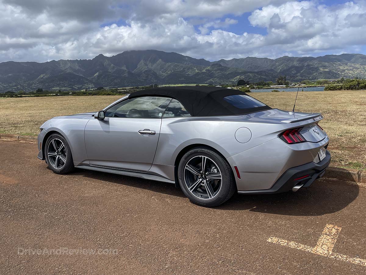 Silver 2025 Ford Mustang Convertible rear three-quarter view with the top up