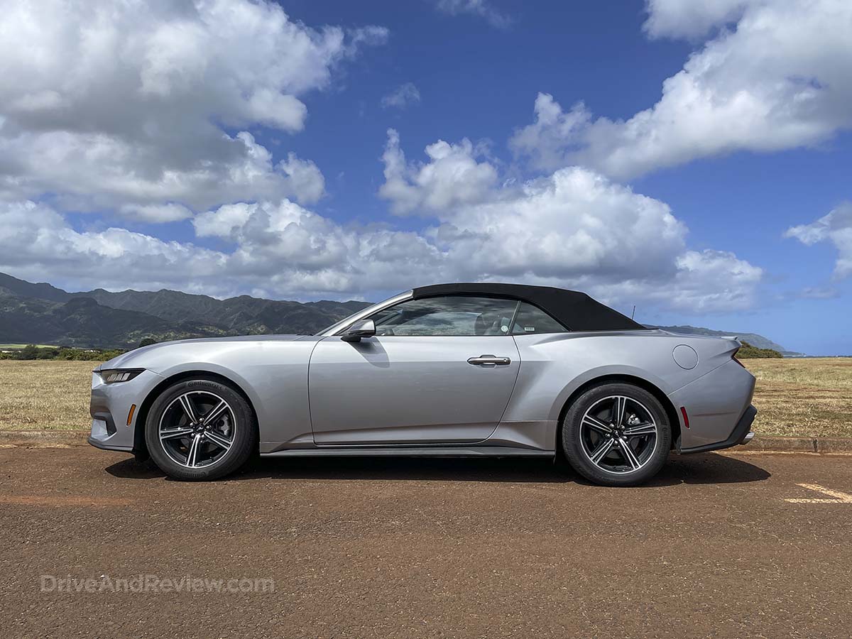 Silver 2025 Ford Mustang convertible side view with the top up