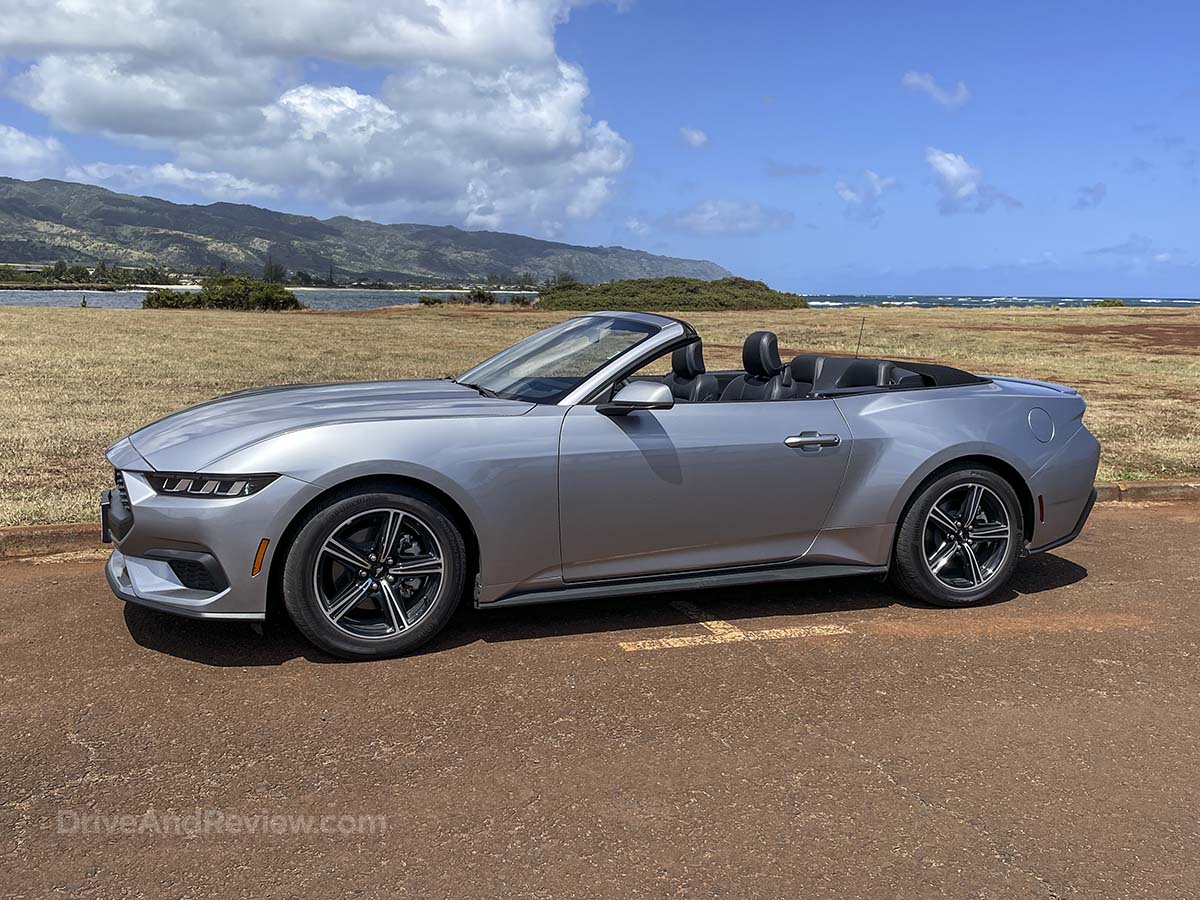 Silver 2025 Ford Mustang convertible with the top down