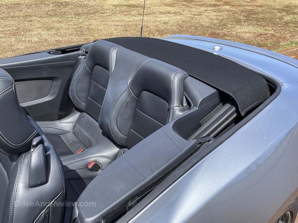 Silver 2025 Ford Mustang convertible rear seats with the top down