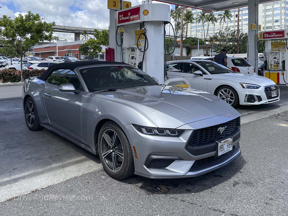 2025 Ford Mustang convertible at the gas station