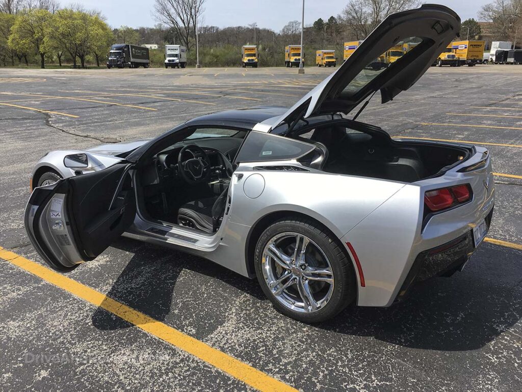 Silver 2016 Corvette Stingray doors and rear hatch open rear 3/4 view