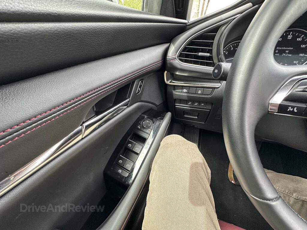 2026 Mazda 3 interior door side panel with switches for power locks and mirrors