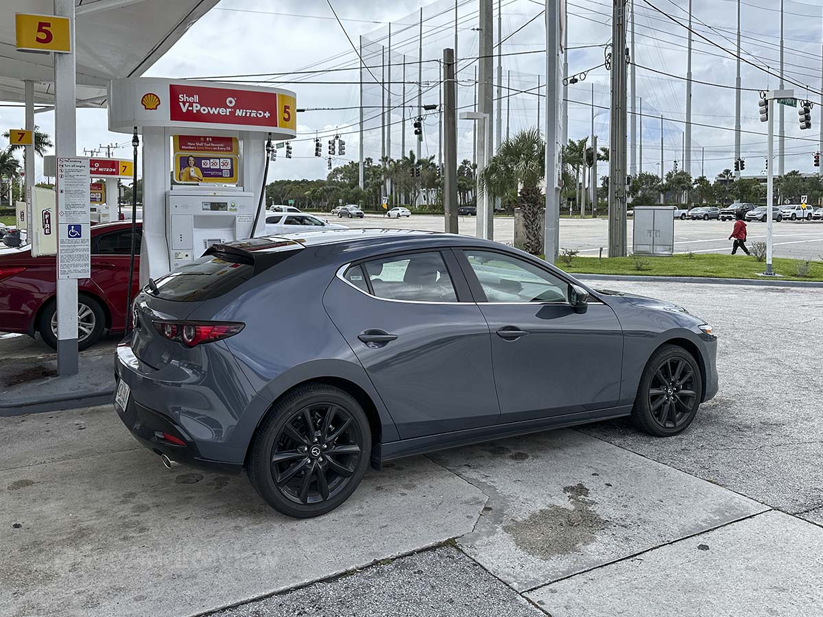 2026 Mazda 3 filling up with gas at the gas station