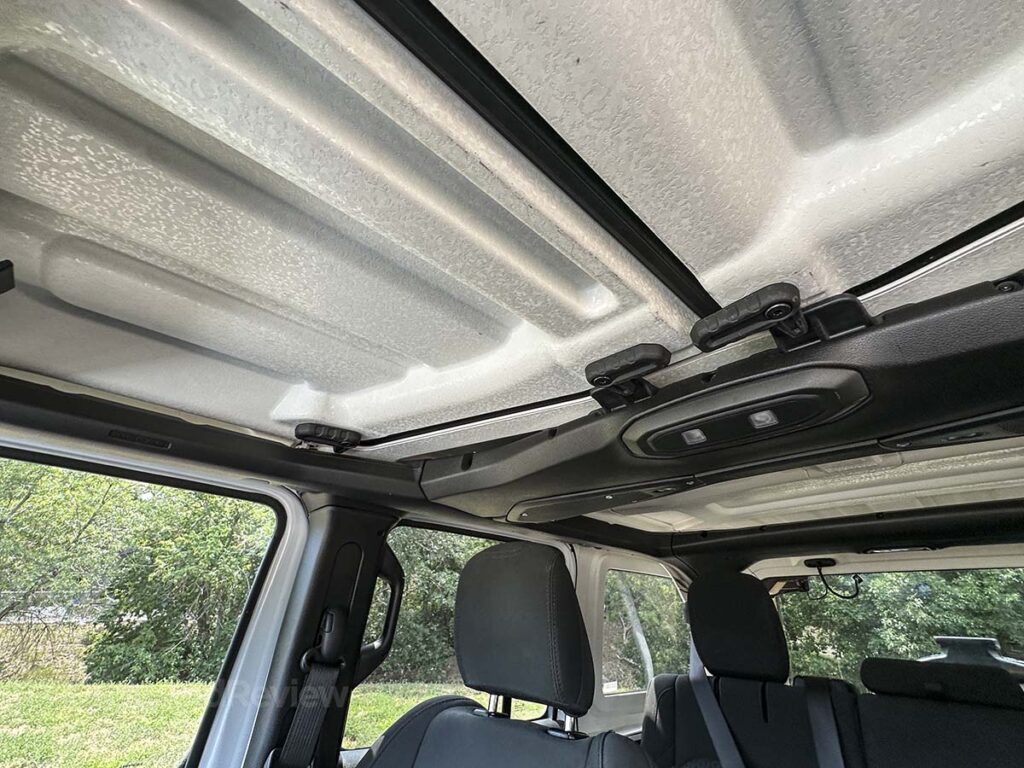 Interior roof panels with release levers in the 2025 Jeep Wrangler Rubicon 4XE 