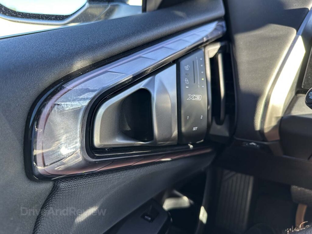 2026 BMW X3 30 driver side interior door handle with power lock controls