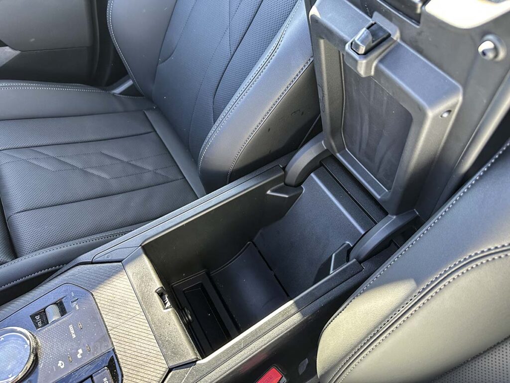 2026 BMW X3 30 storage compartment under armrest in the center console