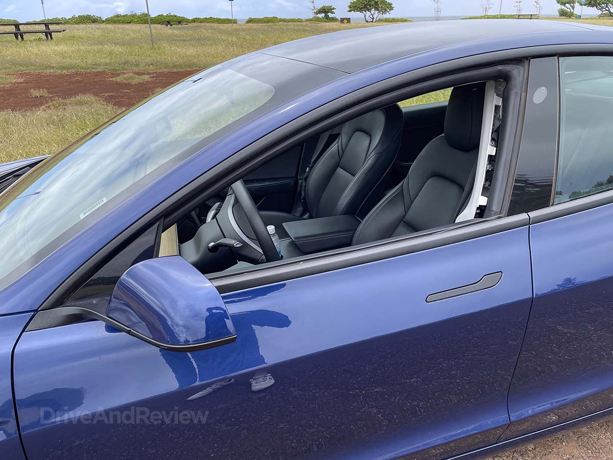 Blue 2023 Tesla model 3 with interior panels coming apart
