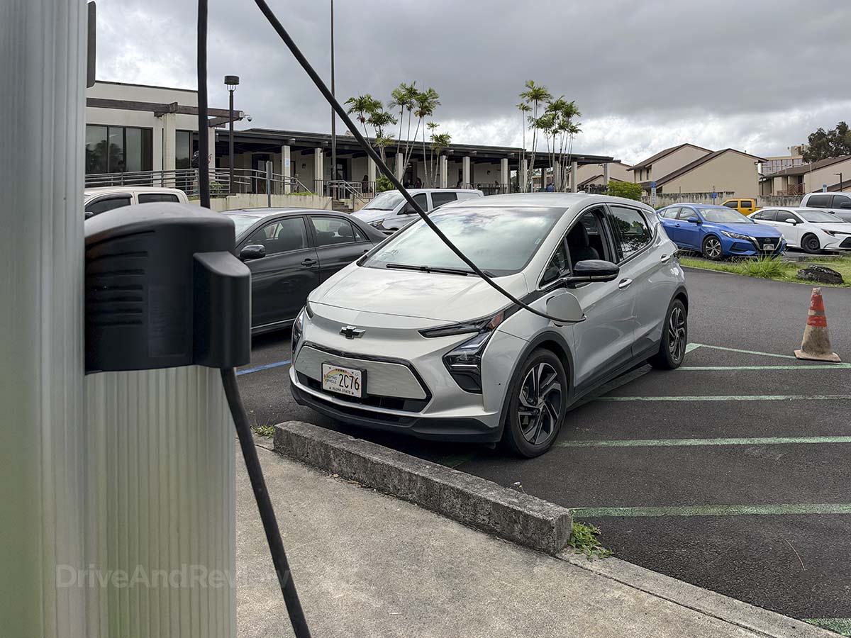 2024 Chevrolet Bolt plugged in at a charging station in Honolulu