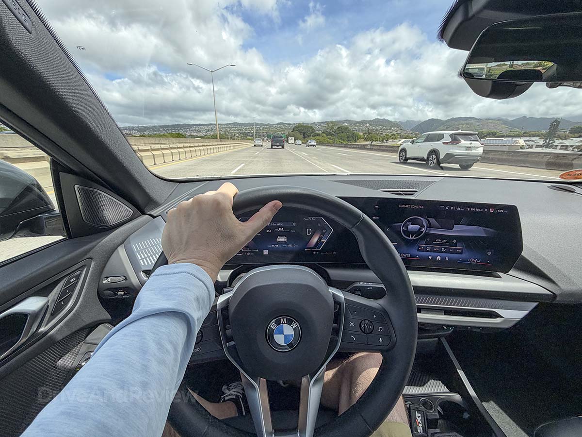 POV driving a 2026 BMW 228 on the freeway