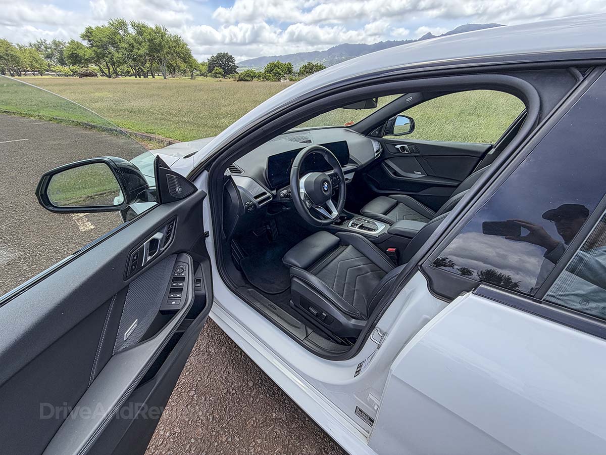 Opening the driver side door on a 2026 BMW 228 xDrive