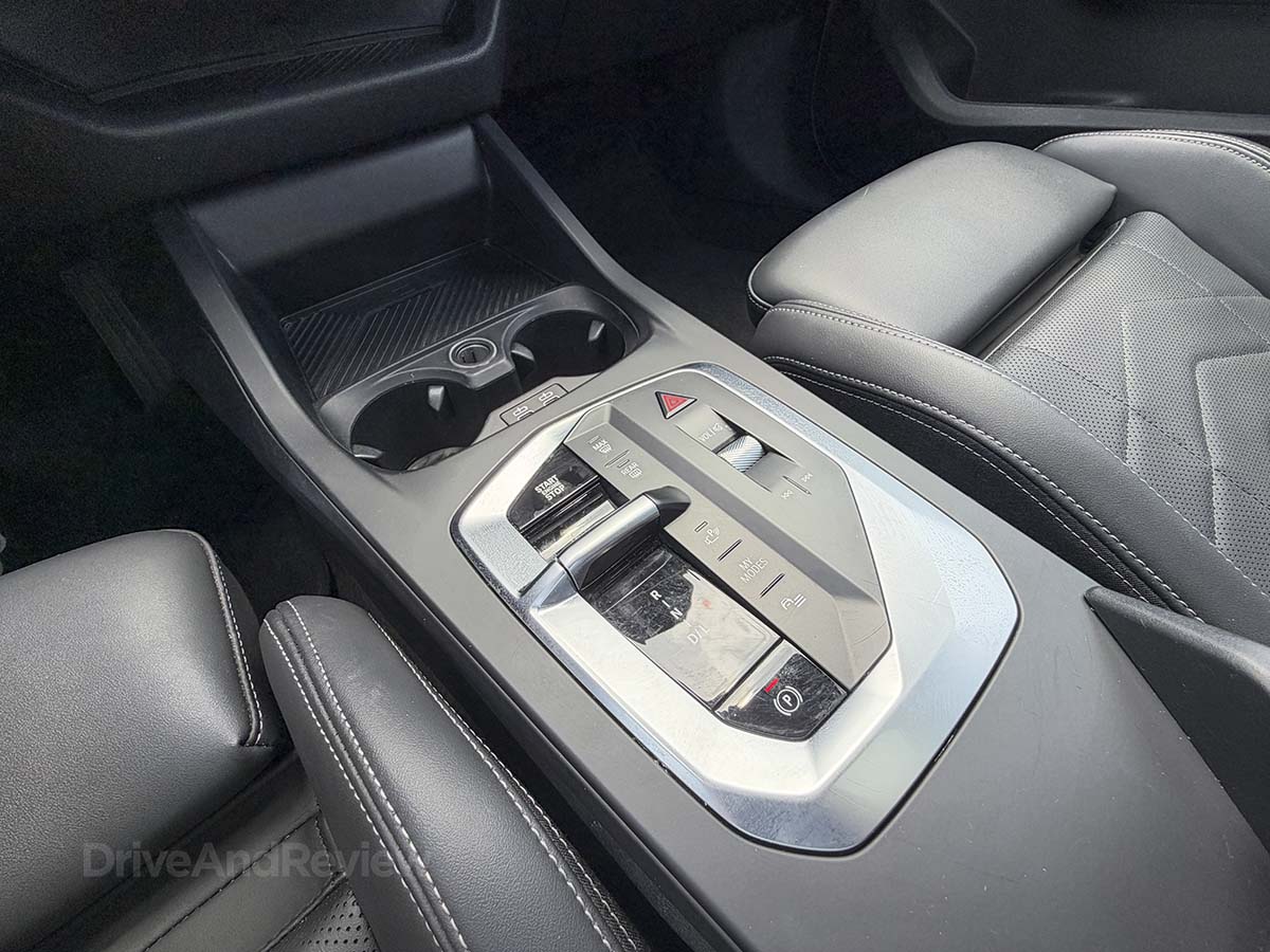 2026 BMW 228 xDrive center console with dual cupholders
