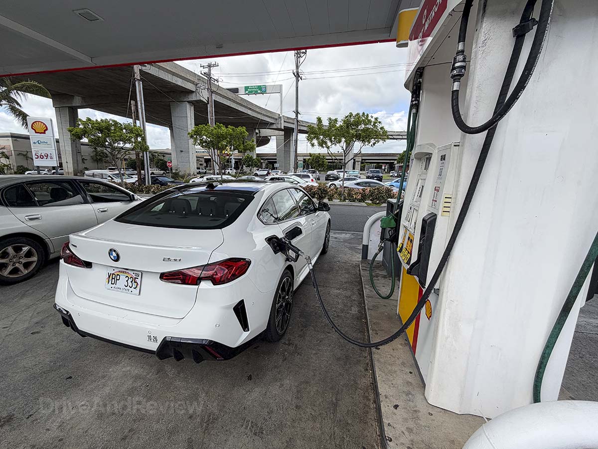 White 2026 BMW 228 xDrive filling up with gas at the gas station